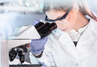 500px Photo ID: 215230985 - Life scientists researching in laboratory. Attractive female young scientist microscoping in their working environment. Healthcare and biotechnology.